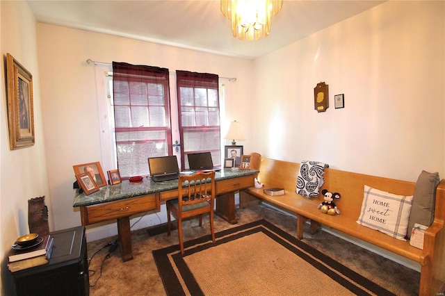 carpeted office space with an inviting chandelier