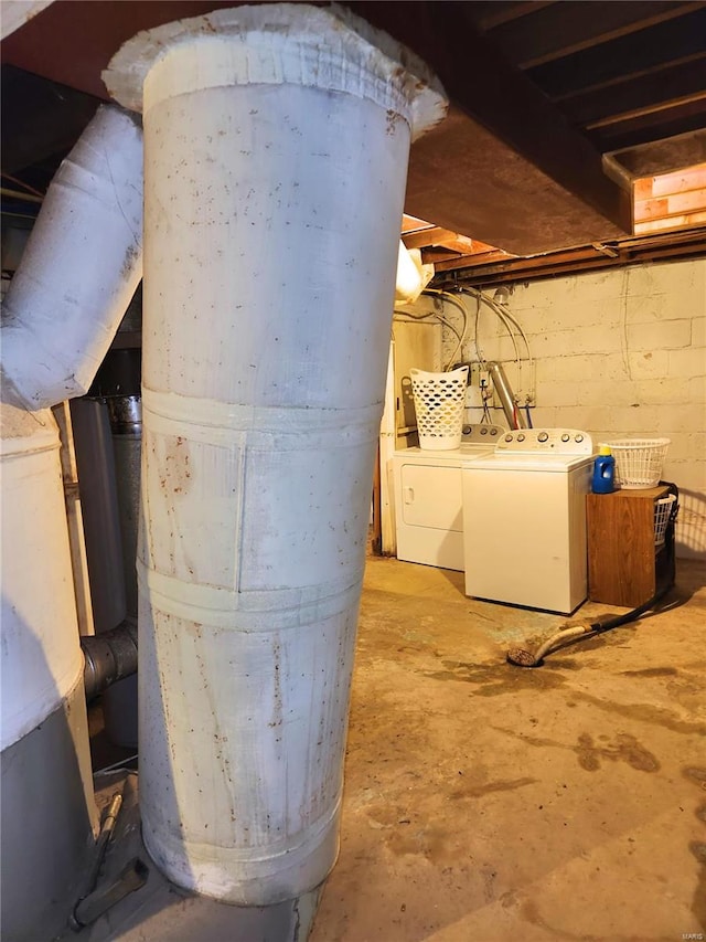 basement featuring washing machine and clothes dryer