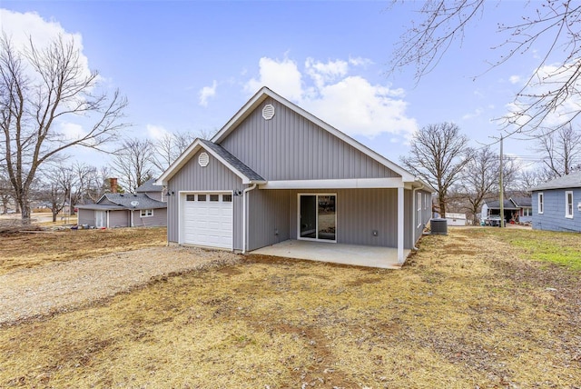 view of front of house featuring a garage, a patio area, and a front yard