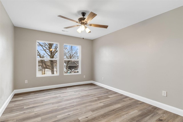 spare room with ceiling fan and light hardwood / wood-style flooring