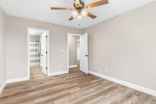 unfurnished bedroom with ceiling fan and light hardwood / wood-style flooring