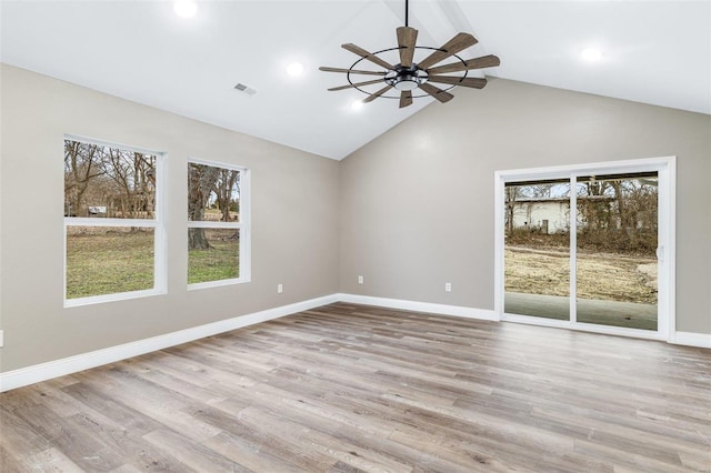 interior space with ceiling fan, lofted ceiling, and light wood-type flooring