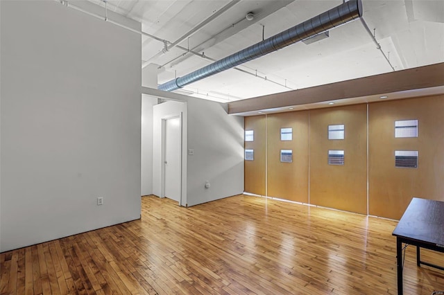 empty room with light hardwood / wood-style floors