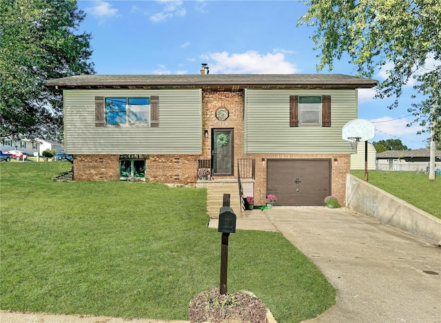 bi-level home featuring a garage and a front lawn