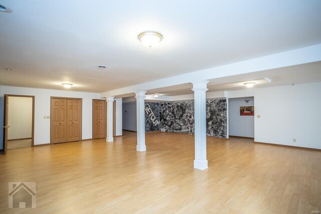 basement with light hardwood / wood-style floors