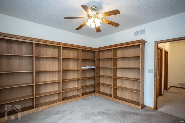 interior space featuring ceiling fan