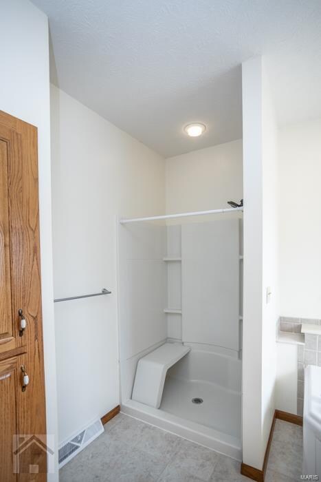 bathroom with walk in shower