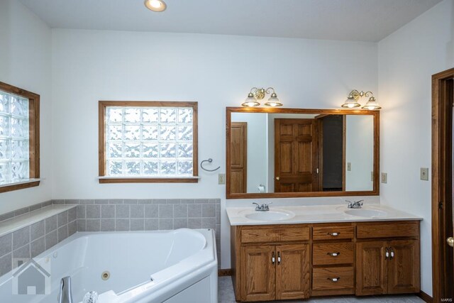 bathroom featuring vanity and a bathtub