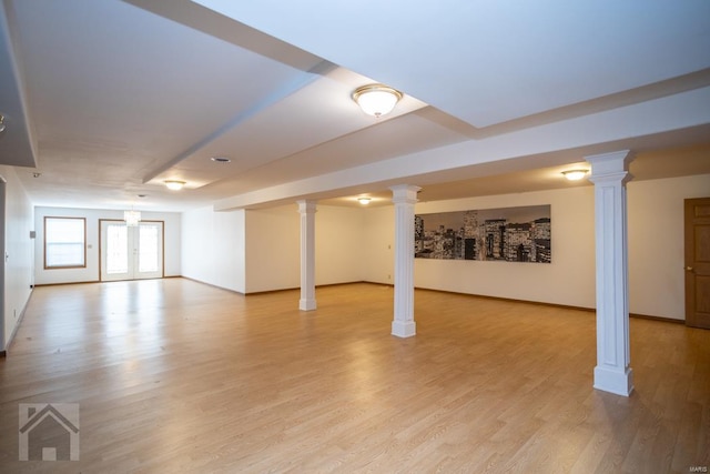 basement with light hardwood / wood-style flooring