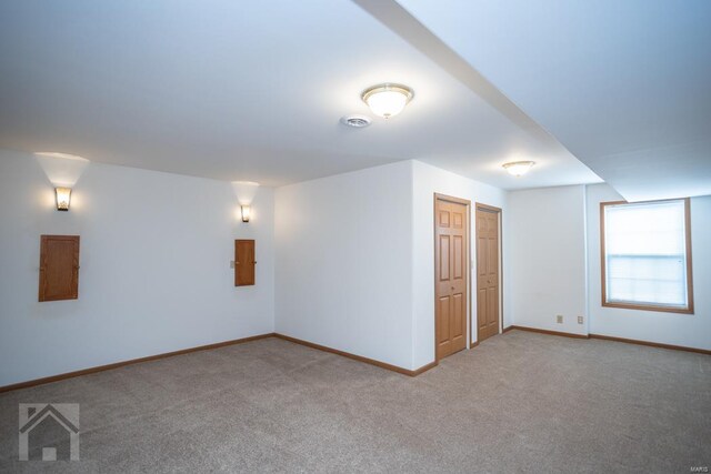 unfurnished room with electric panel and carpet