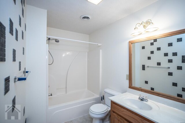 full bathroom with vanity, toilet, bathtub / shower combination, and a textured ceiling