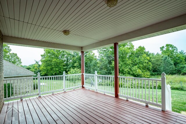 deck featuring a lawn