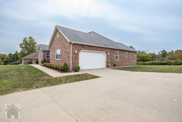 view of home's exterior featuring a garage and a yard