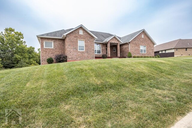 view of front of home with a front lawn