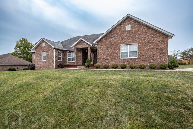 view of front of property with a front lawn