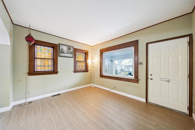 empty room with light hardwood / wood-style floors