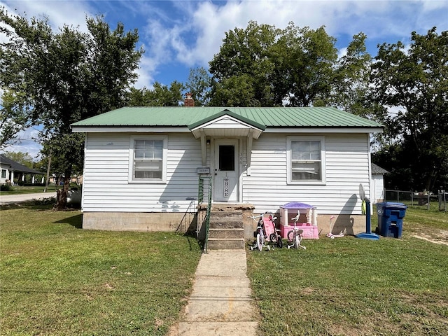 view of front of home with a front yard