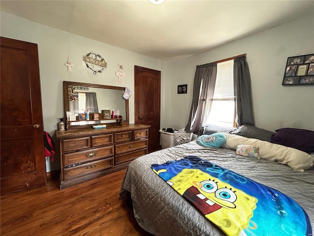 bedroom featuring dark hardwood / wood-style flooring