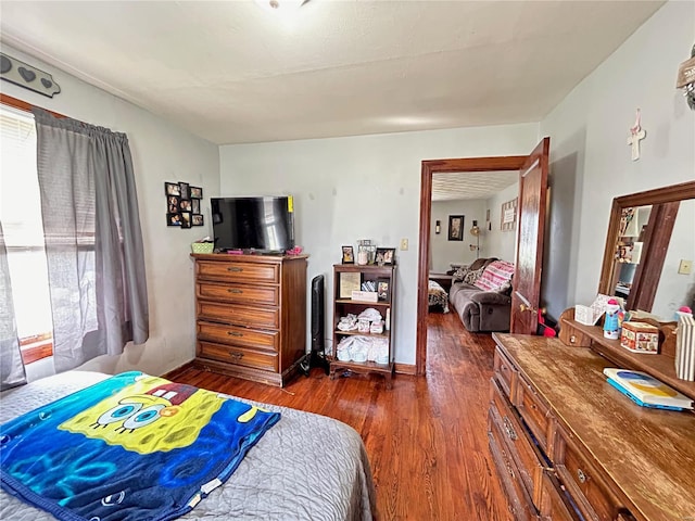 bedroom featuring dark hardwood / wood-style floors