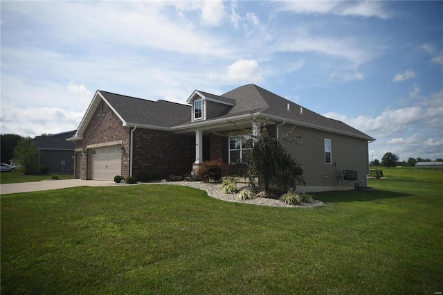 view of front of house with central air condition unit, a garage, and a front lawn