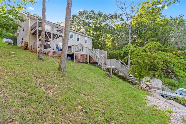 exterior space featuring a yard and a wooden deck