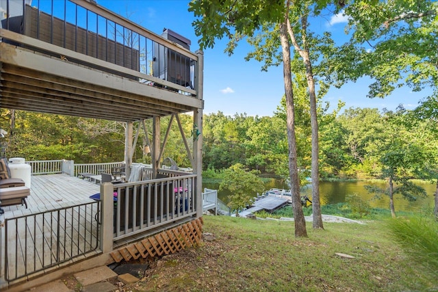 view of yard featuring a deck with water view