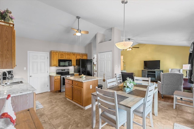 kitchen featuring ceiling fan, sink, a center island, lofted ceiling, and black appliances