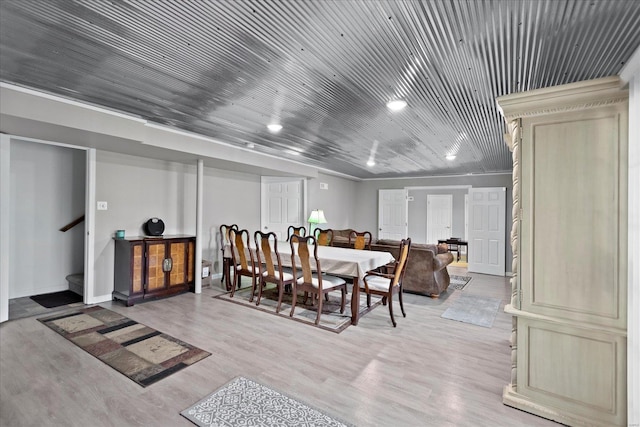 dining space featuring wooden ceiling and light hardwood / wood-style flooring