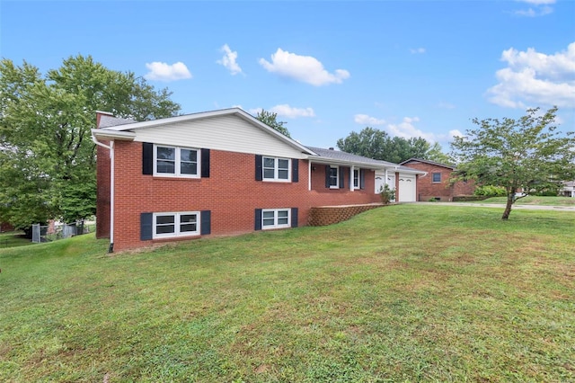 view of front facade with a front yard and a garage