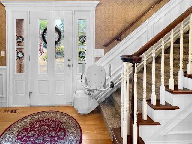 foyer entrance with wood-type flooring