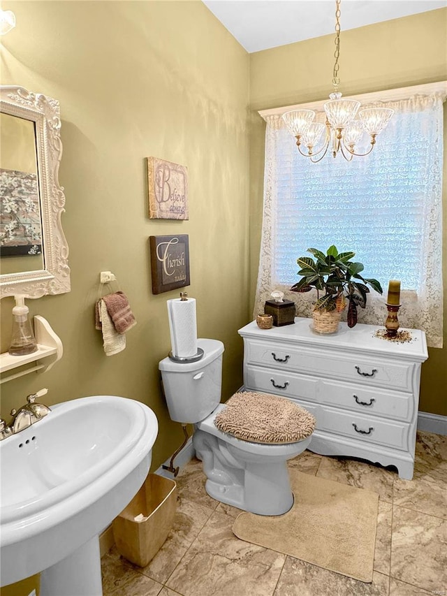 bathroom featuring toilet and sink