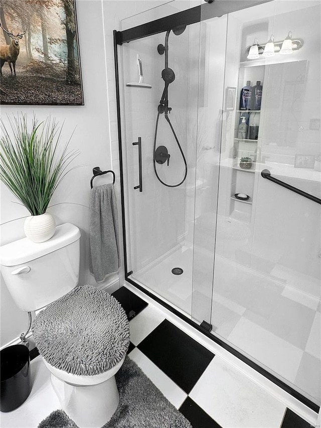 bathroom with toilet and walk in shower