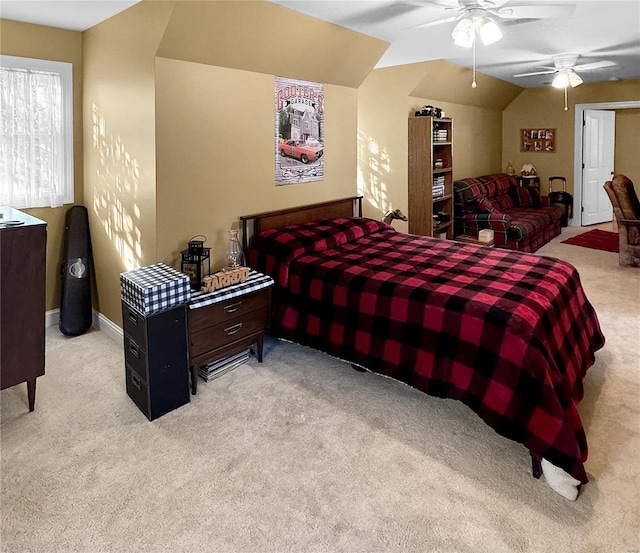 bedroom with light carpet, vaulted ceiling, and ceiling fan