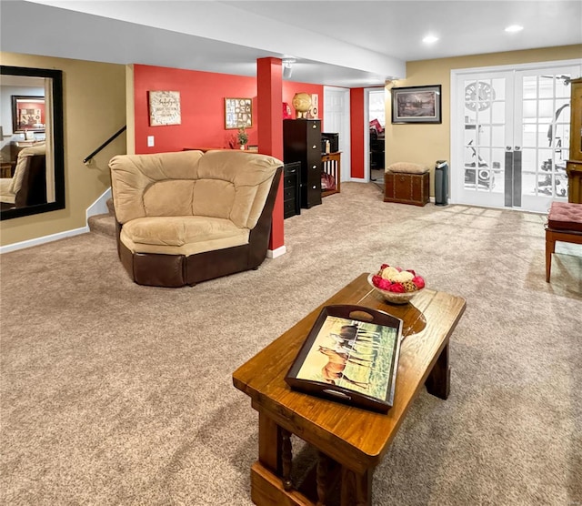 carpeted living room with ornate columns