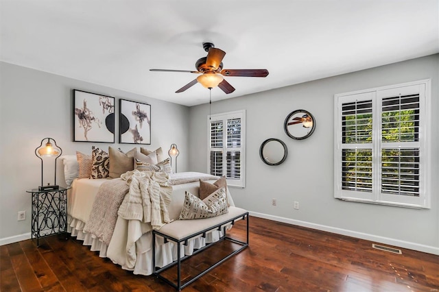 bedroom featuring ceiling fan and dark wood-type flooring