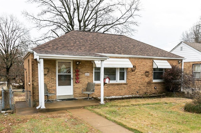 bungalow-style home featuring a front yard