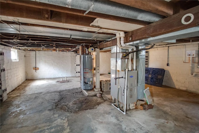 basement featuring heating unit and water heater