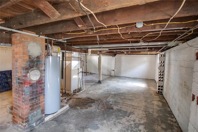 basement with water heater and heating unit