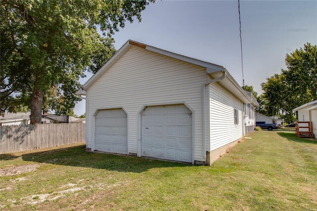 garage with a lawn