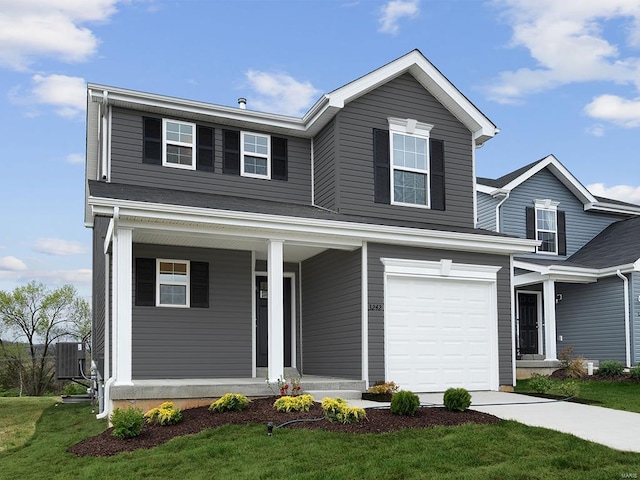 view of front property with central air condition unit, a front yard, covered porch, and a garage