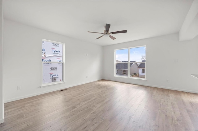 unfurnished room featuring light wood-type flooring and ceiling fan