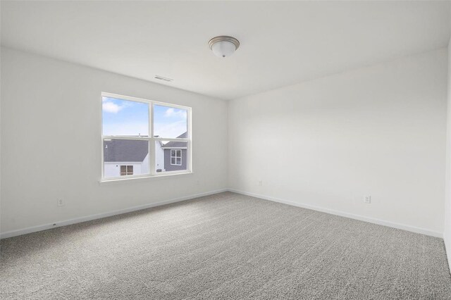 unfurnished room featuring carpet floors