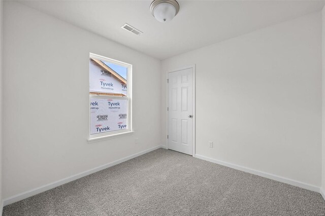 unfurnished room featuring carpet flooring