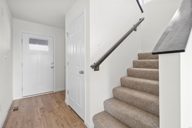 entryway with wood-type flooring