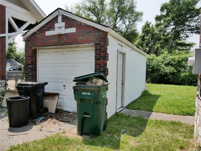 garage featuring a yard