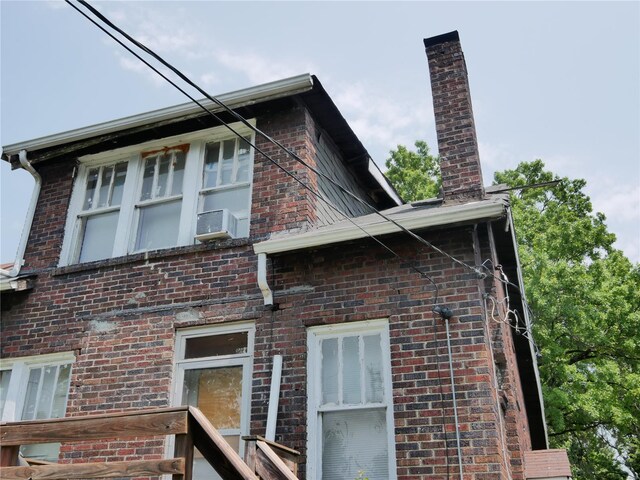 view of side of home with cooling unit