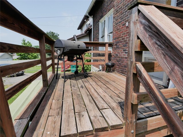 wooden terrace with area for grilling