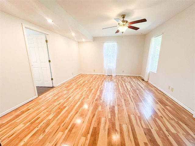 unfurnished room with wood-type flooring and ceiling fan