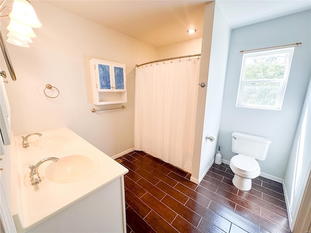 bathroom with vanity, toilet, and a shower with shower curtain