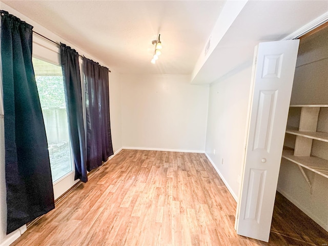 spare room featuring light hardwood / wood-style flooring